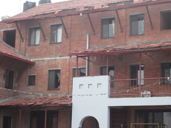 Damage to tiles from the front of the Ama Ghar homes.