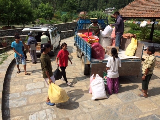 At Ama Ghar, loading trucks with supplies for displaced persons