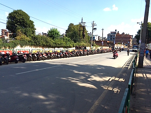 The road to Patan - motorcycles lined up along the road, awaiting fuel!