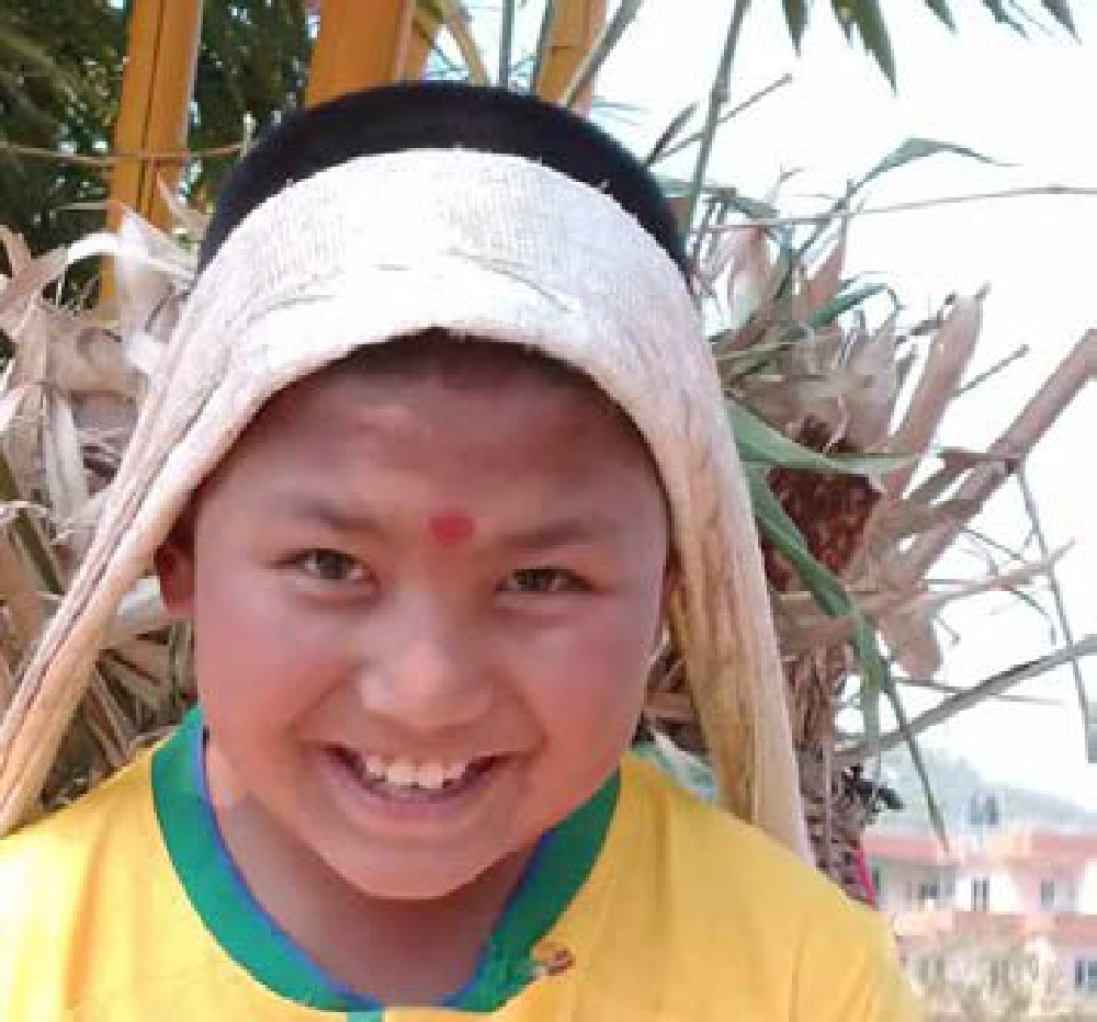 child enjoying being at ama ghar