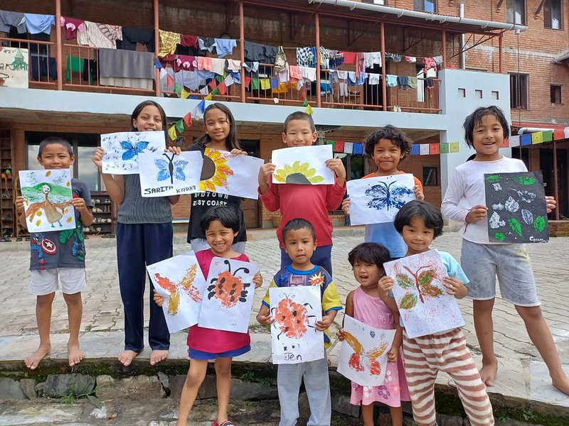 ama ghar kids with their paint work