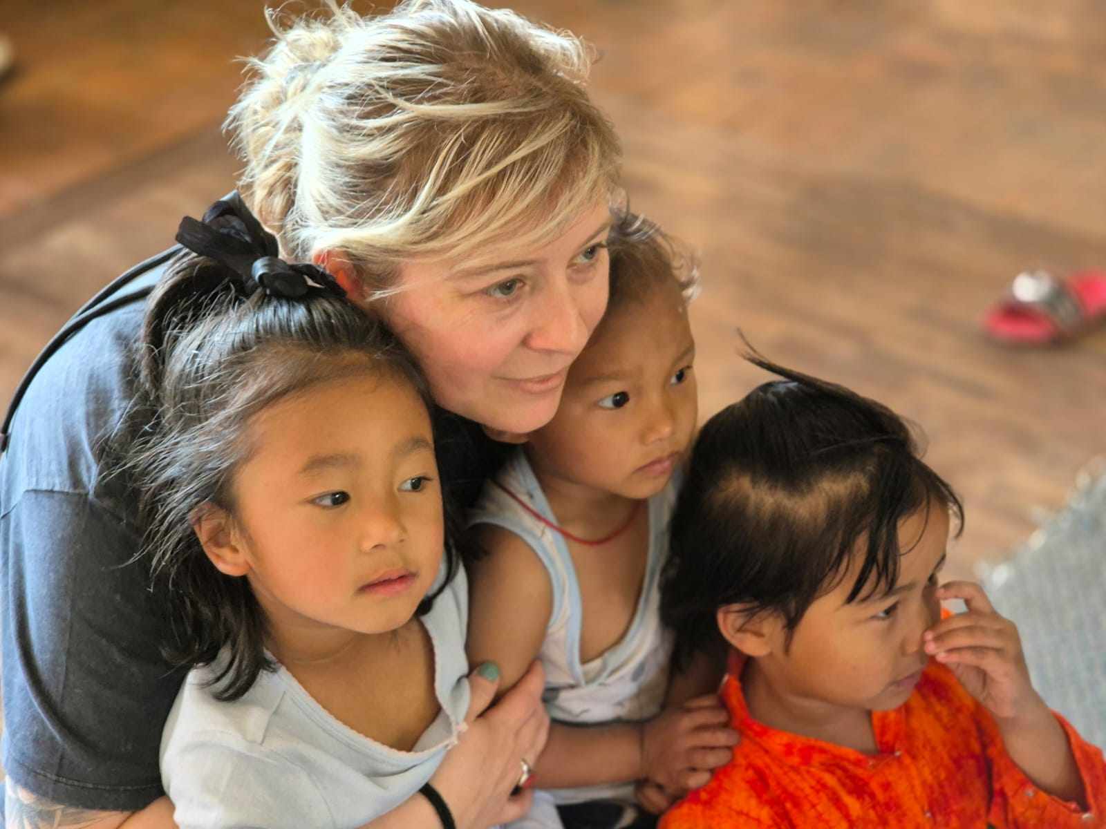 visitor with Ama Ghar kids